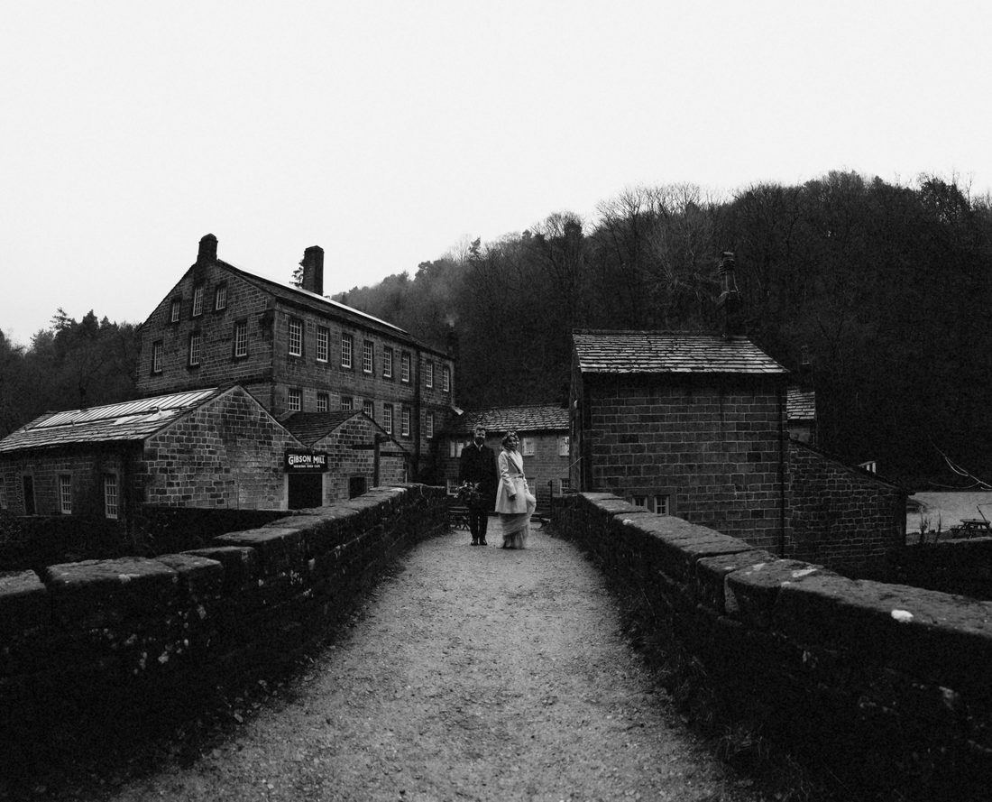 Brooke and Matt walking at Gibson Mill in Hebden Bridge, black and white
