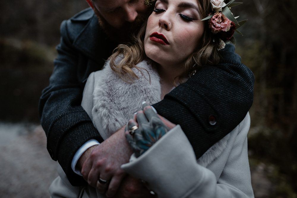 Brooke and Matt in a close embrace in deep winter