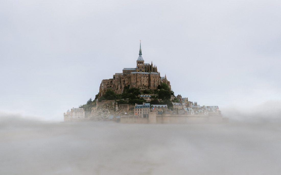 Mont-Saint-Michel rising out of the mist in Normandy